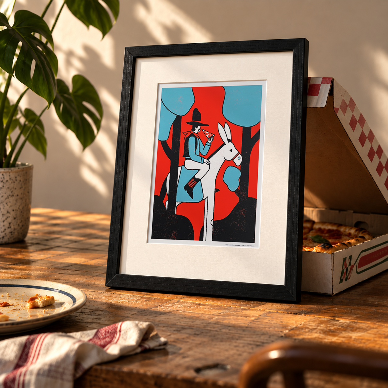 framed Screen print of a Cowboy on a donkey eating a slice of salami pizza.